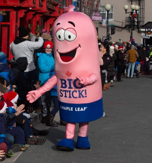 (GOTTA HEAR THIS) Out East, A Giant Walking Meat Stick Is Taking The Spotlight At Santa Claus Parades