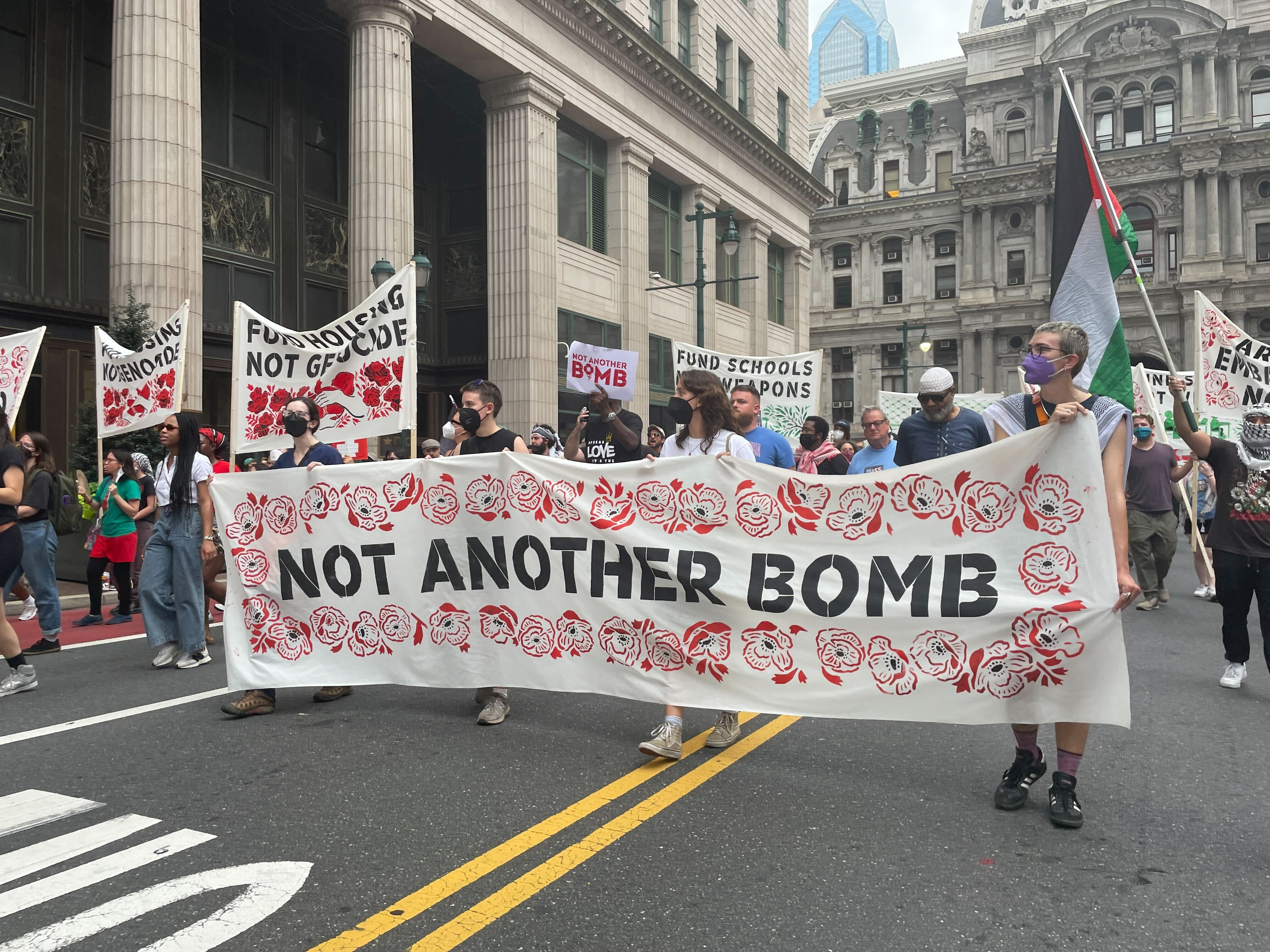 Pro-Palestinian demonstrators gather outside City Hall as negotiators seek to finalize Gaza cease fire