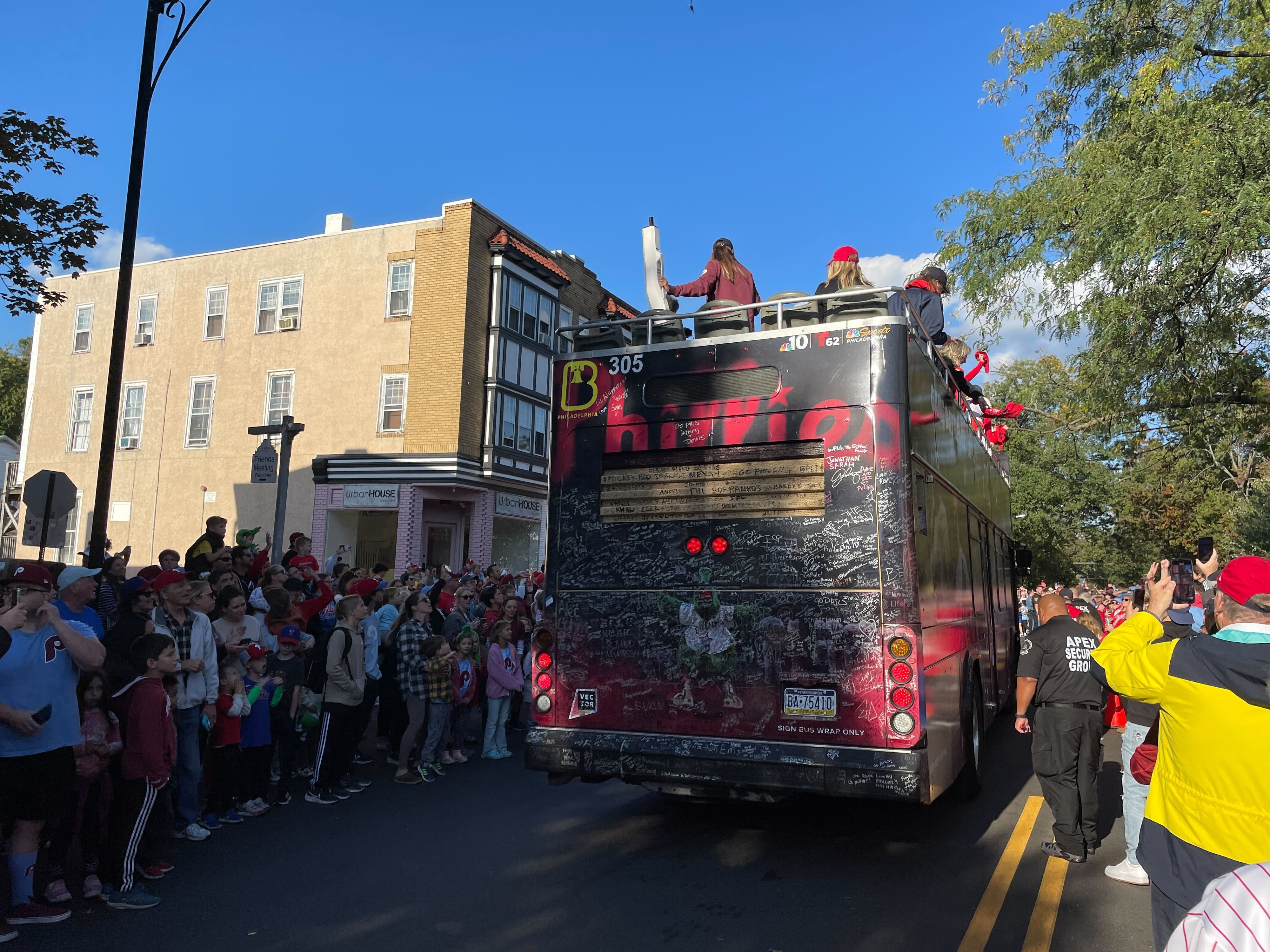 Phillies fans celebrate during Rally for Red October bus tour