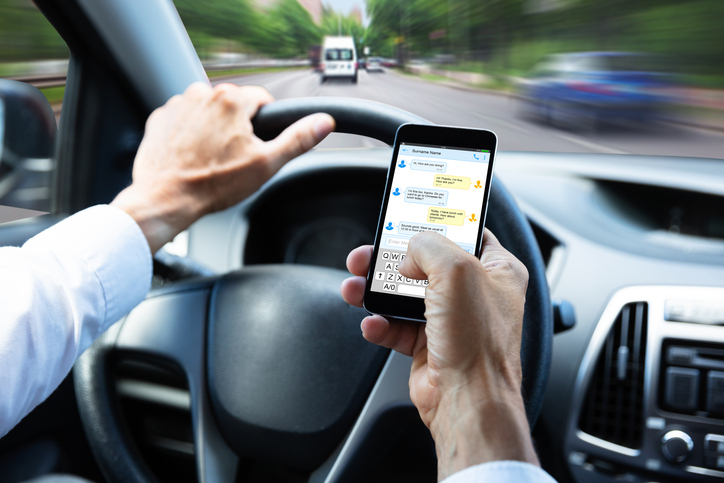 Critics say the old distracted driving law in Michigan didn't do enough. Can a new law fix that without going too far?