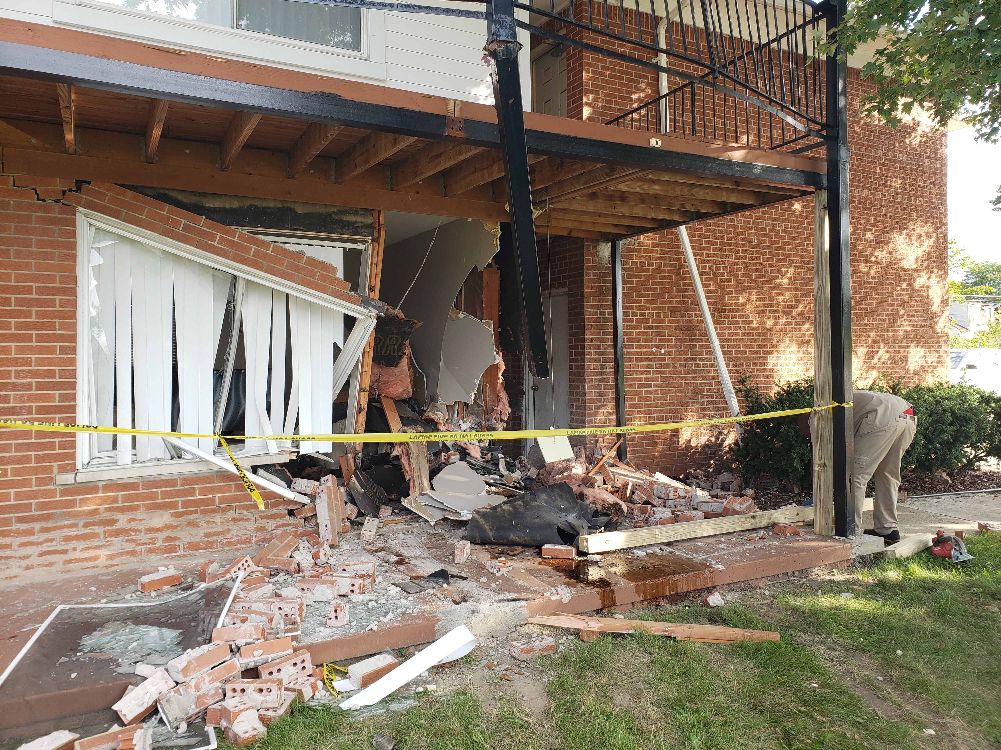 Cleanup underway after woman crashes car into Detroit apartment building