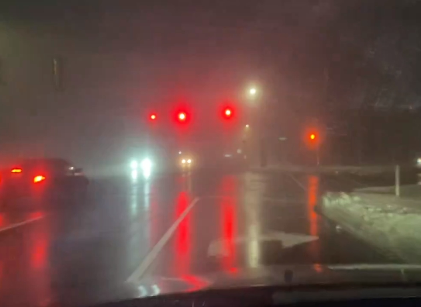 Heavy fog blanketing Metro Detroit reduces visibility to 1/4 mile or less as black ice coats untreated roads