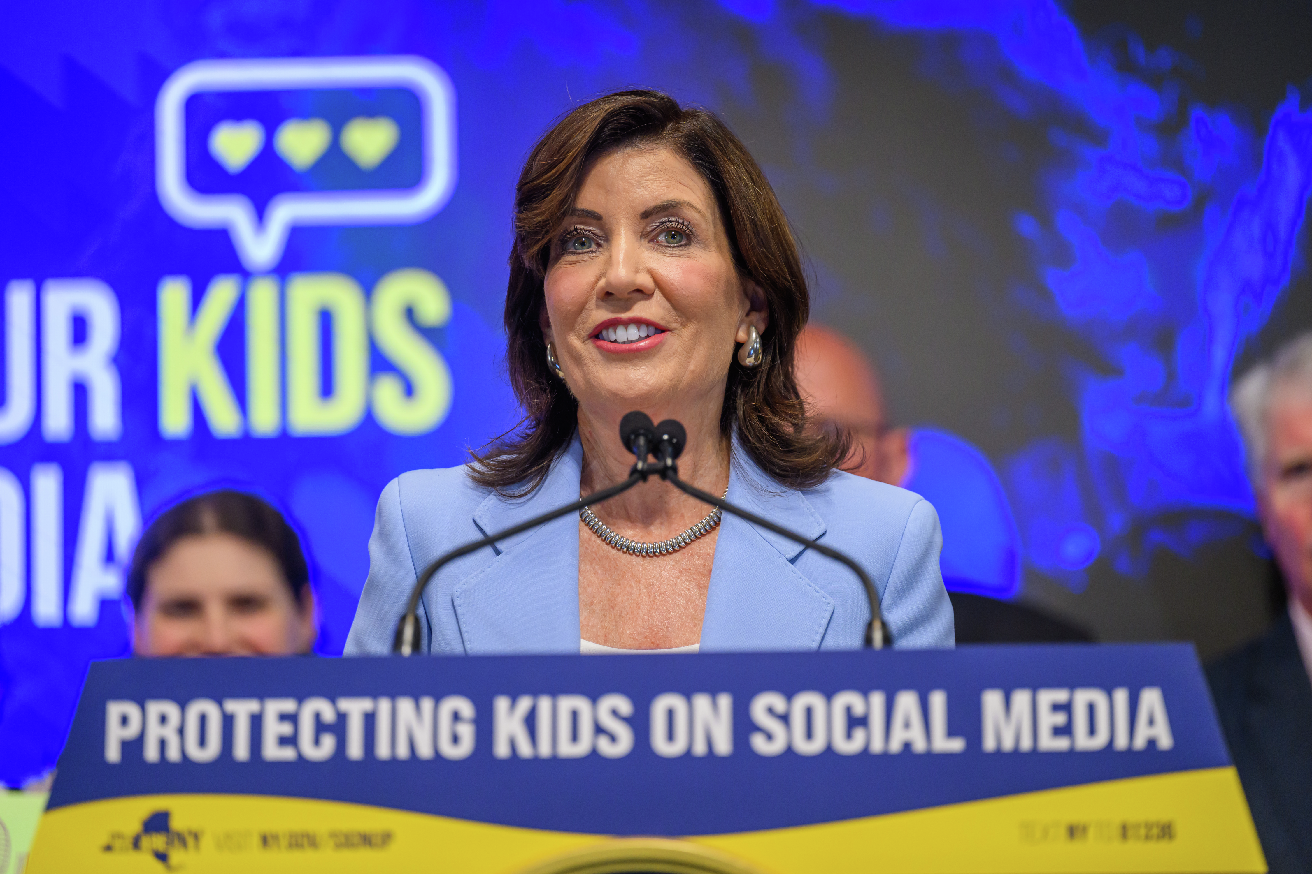 New York Gov. Kathy Hochul signs a bill into law that restricts addictive social media feeds for children