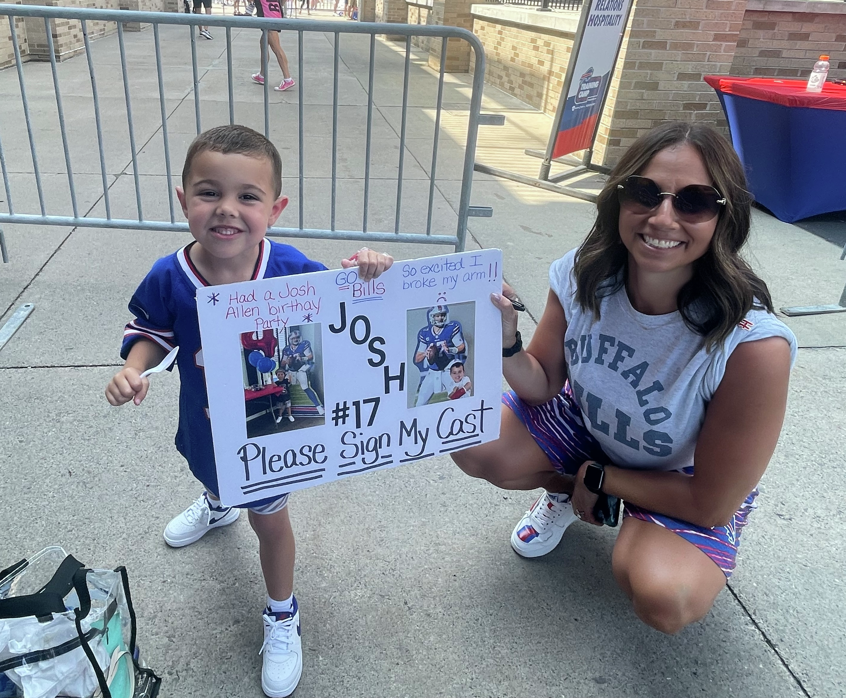 Bills fan Alie from Michigan with her 4-year-old son Camden taking in Day 1 of Bills training camp at St. John Fisher University in Pittsford