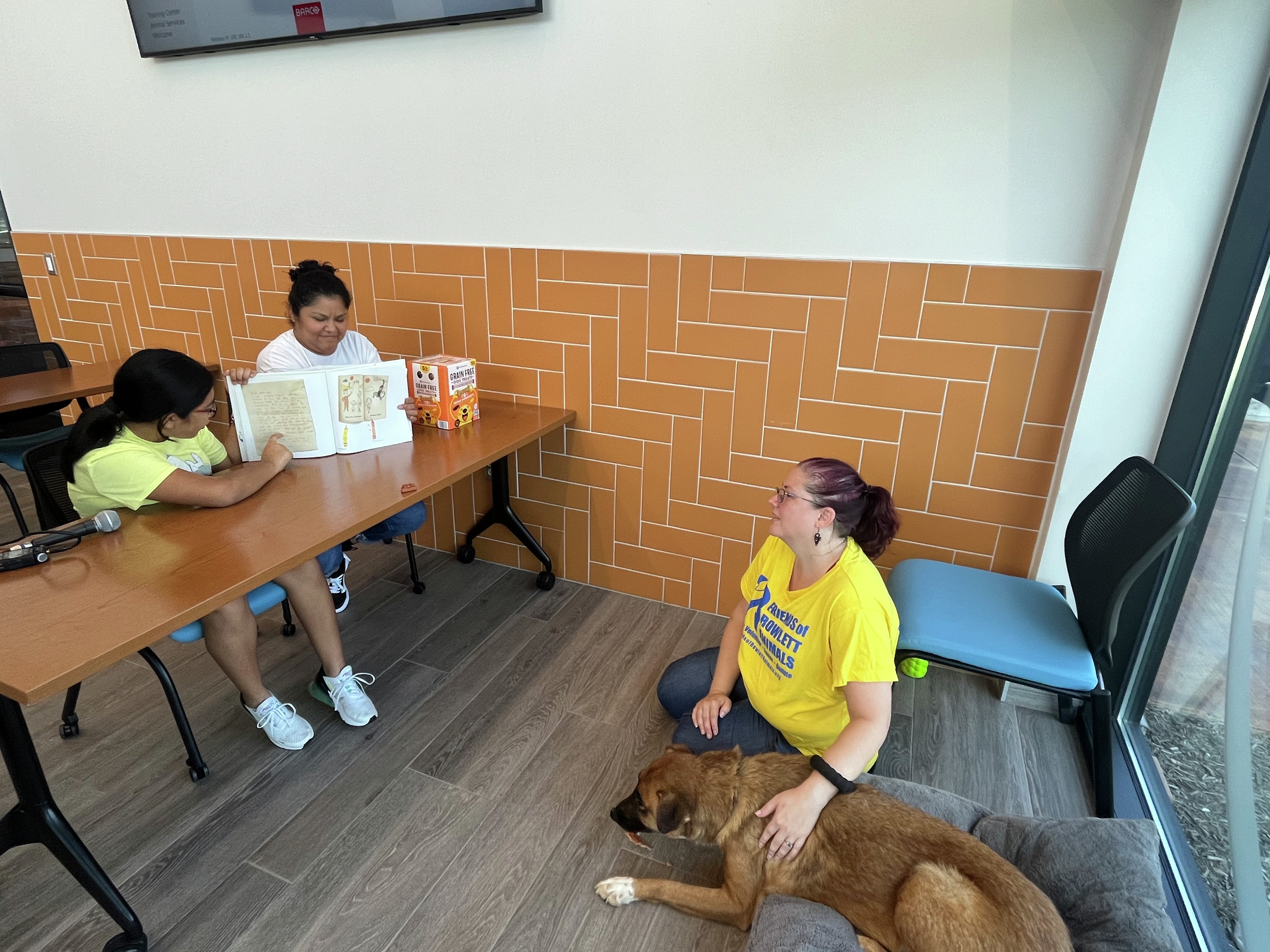 Garland students prepare for school by reading to shelter animals