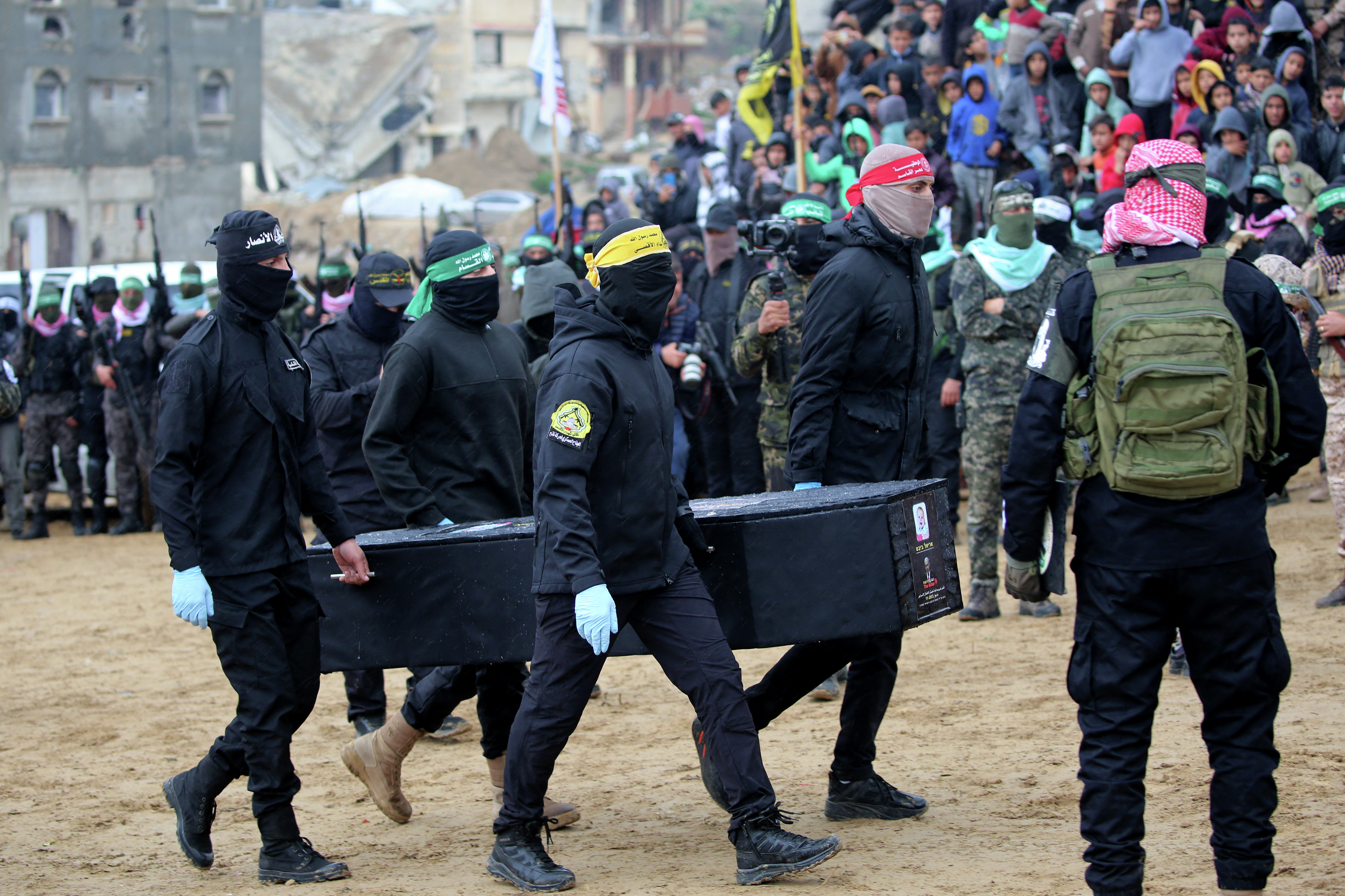 Day 503 - In grotesque 'ceremony,' Hamas hands over 4 coffins - podcast episode cover