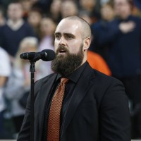 Local resident Tom Zepp sings the National Anthem